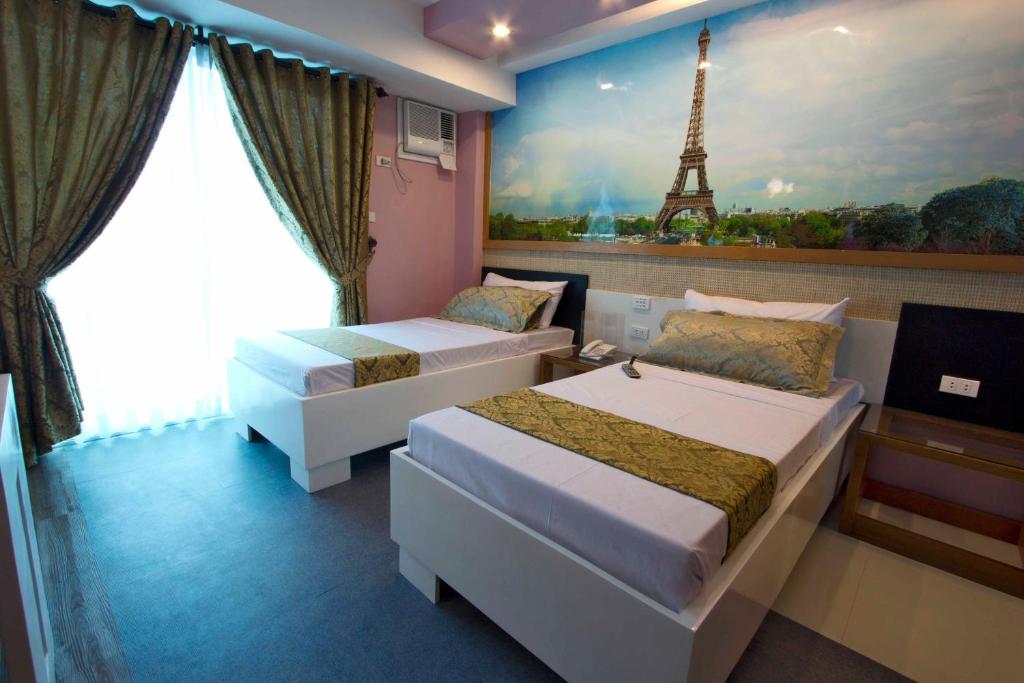 Postel nebo postele na pokoji v ubytování Eurotel Boracay