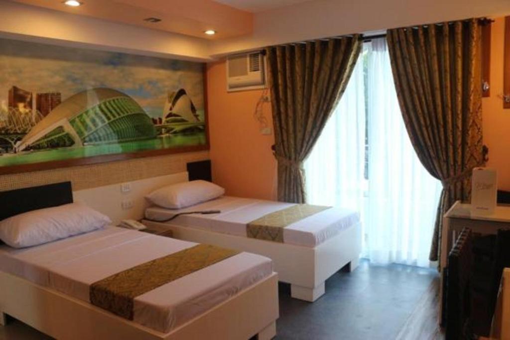 Postel nebo postele na pokoji v ubytování Eurotel Boracay