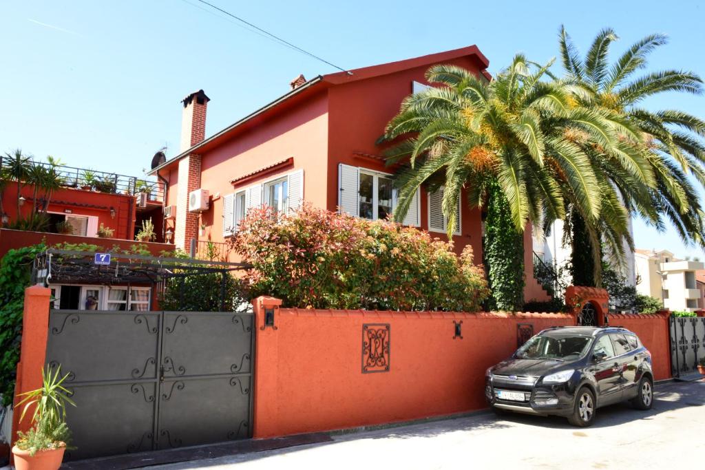 a car parked in front of a house at City House Apartments in Tivat
