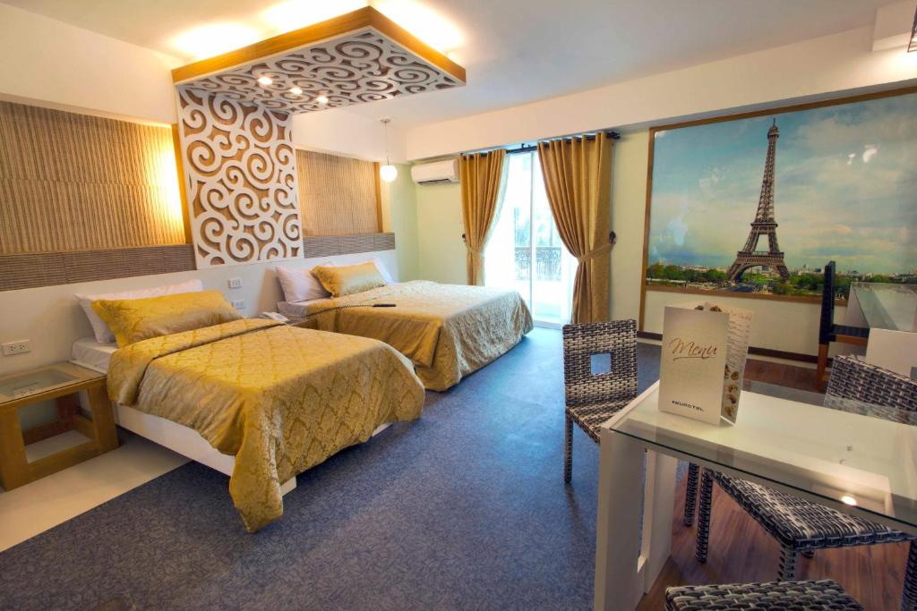 Postel nebo postele na pokoji v ubytování Eurotel Boracay