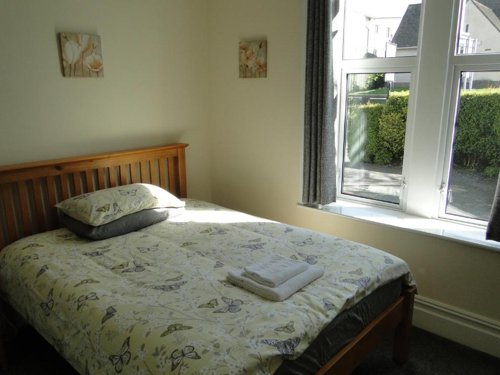 Postel nebo postele na pokoji v ubytování Rockleaze Guesthouse