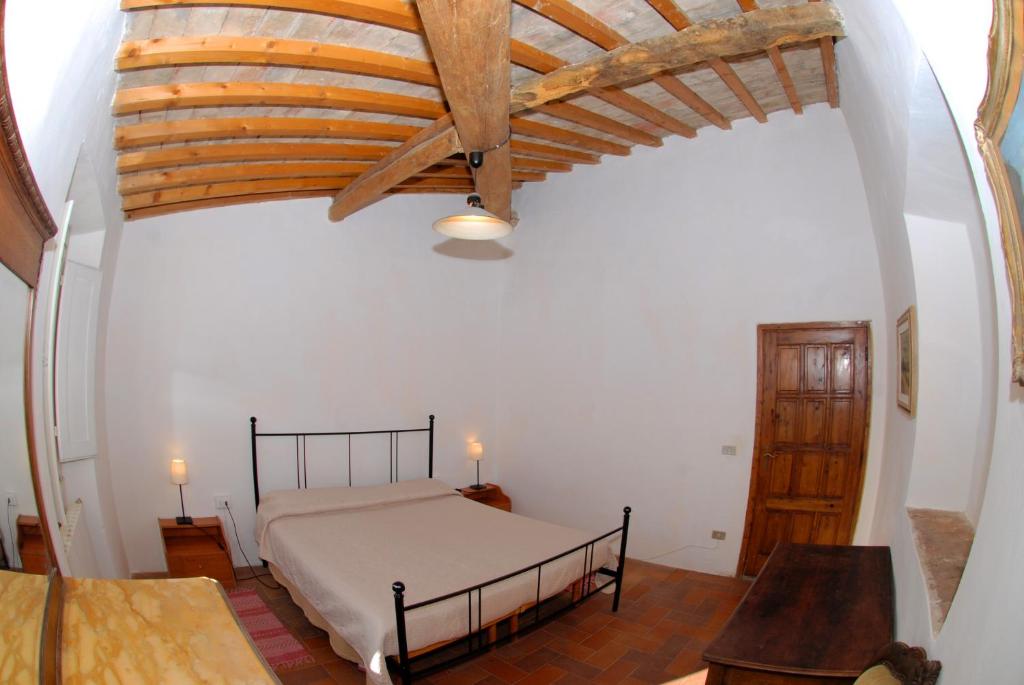 Postel nebo postele na pokoji v ubytování Agriturismo I Poggi