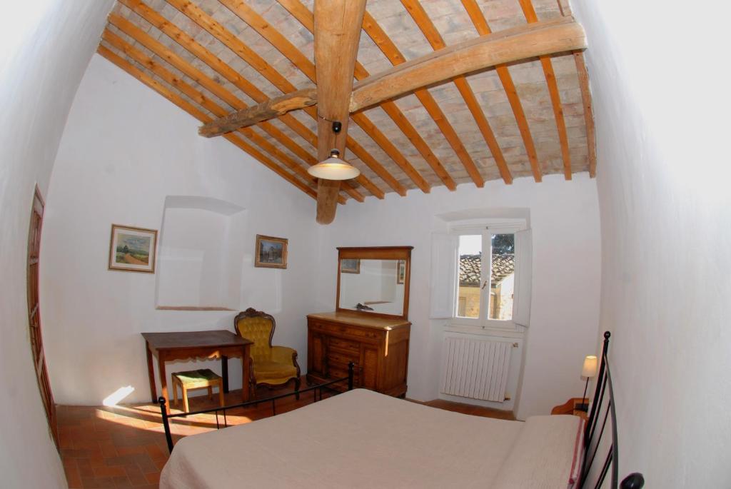 Postel nebo postele na pokoji v ubytování Agriturismo I Poggi