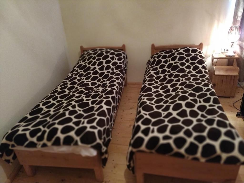 Postel nebo postele na pokoji v ubytování Ecohouse Svaneti