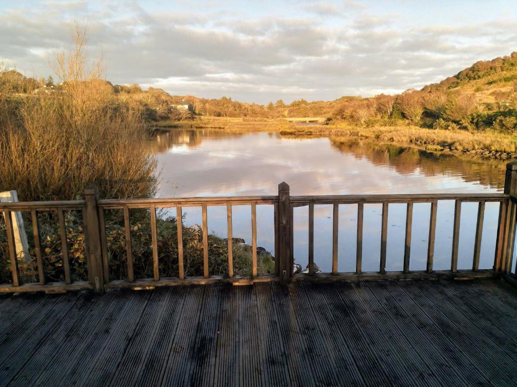 a view of a river from a wooden bridge at Watersedge in Mulranny