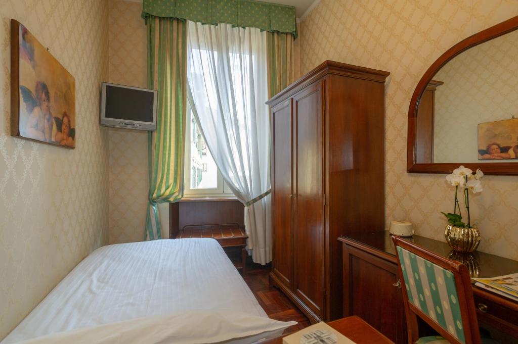 Postel nebo postele na pokoji v ubytování Hotel Boccaccio