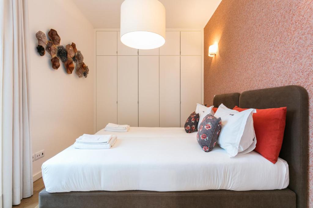 Postel nebo postele na pokoji v ubytování FLH Restauradores Modern Apartment