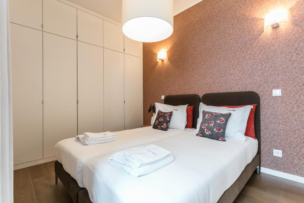 Postel nebo postele na pokoji v ubytování FLH Restauradores Modern Apartment