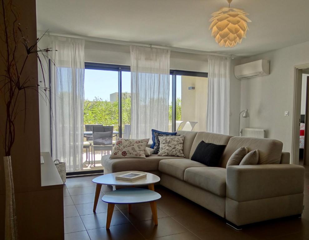 a living room with a couch and a table at Ô de Mer at My Luxury Home in Provence in La Ciotat