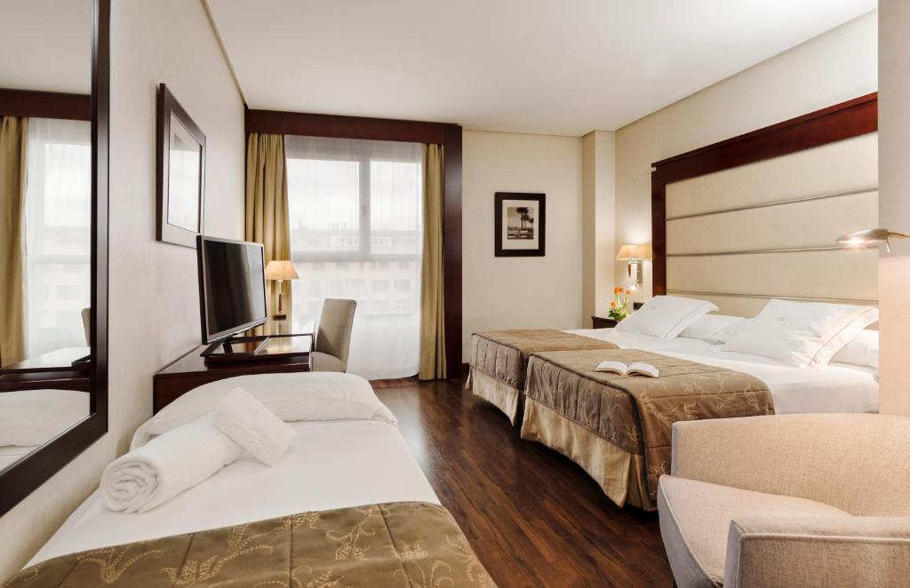 Cama o camas de una habitación en Hotel Valencia Center