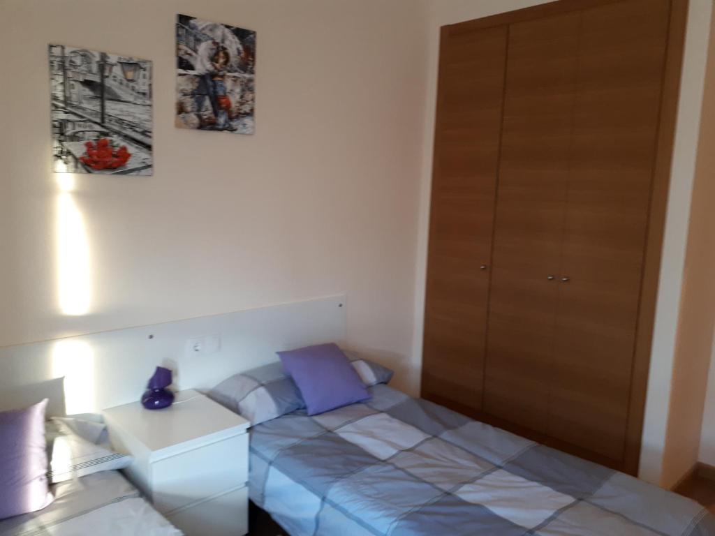 Łóżko lub łóżka w pokoju w obiekcie Chalet adosado 3 dormitorios