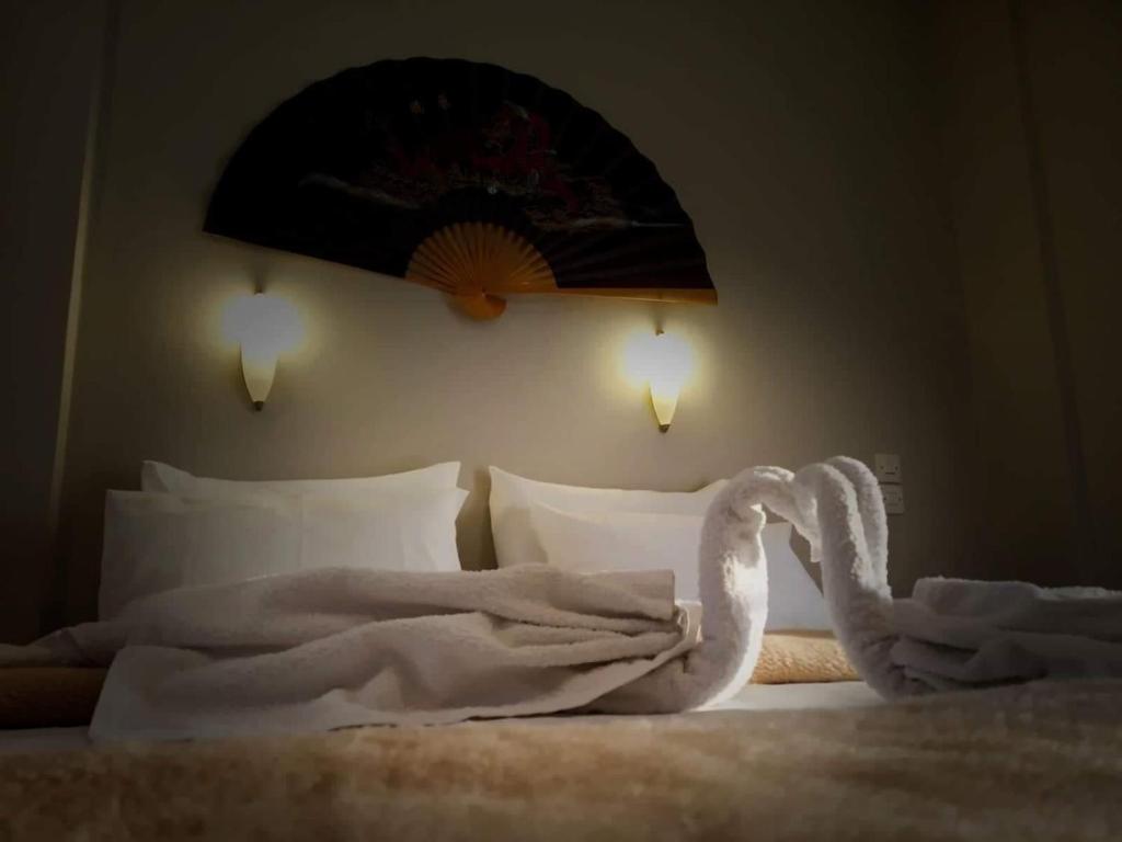 Cama o camas de una habitación en Oskars Studios & Apartments