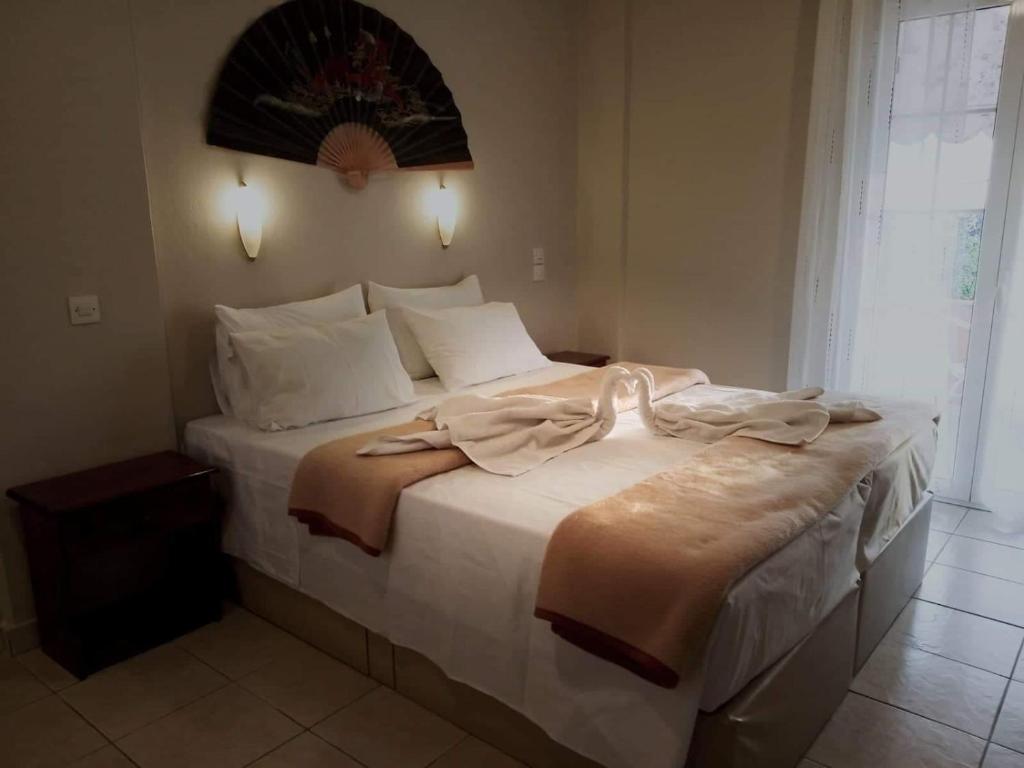 Cama o camas de una habitación en Oskars Studios & Apartments