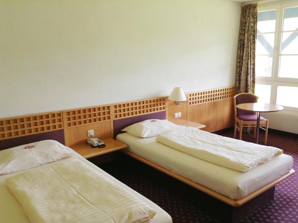 Postel nebo postele na pokoji v ubytování Rosenberger Motel Völkermarkt