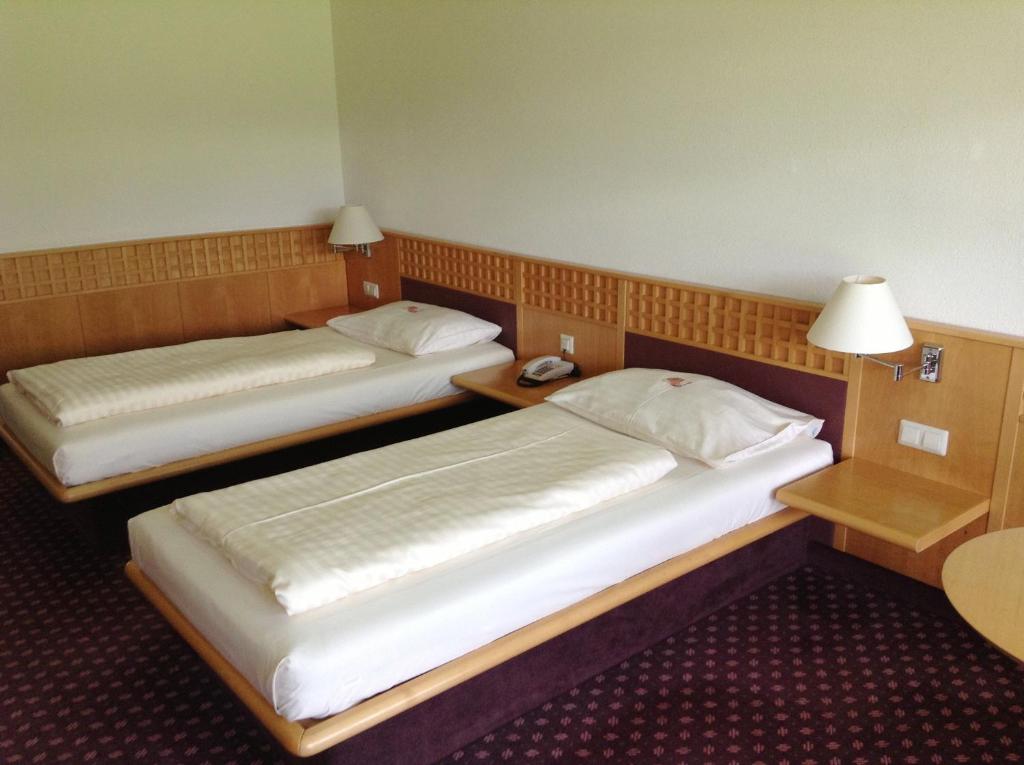 Postel nebo postele na pokoji v ubytování Rosenberger Motel Völkermarkt