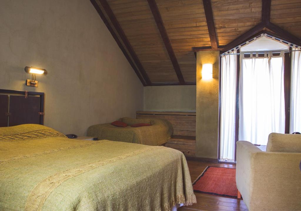 Postel nebo postele na pokoji v ubytování Tufenkian Avan Marak Tsapatagh Hotel