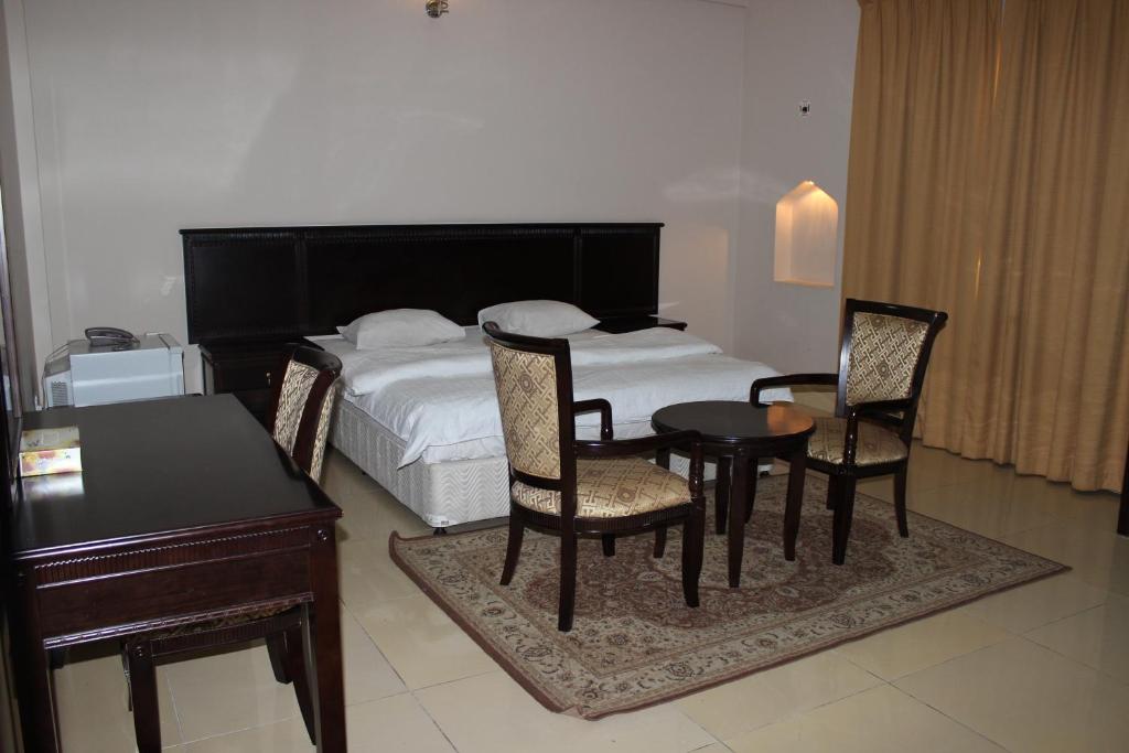 Voodi või voodid majutusasutuse Gulf Crown Hotel Apartment toas