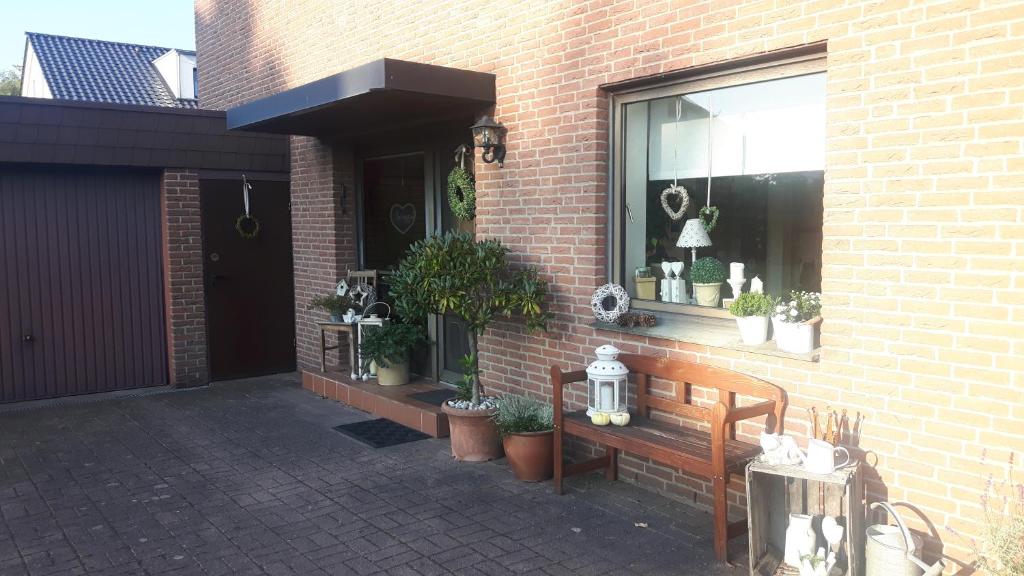 a brick building with a window with potted plants on it at Lieblingsplatz in Horn-Bad Meinberg