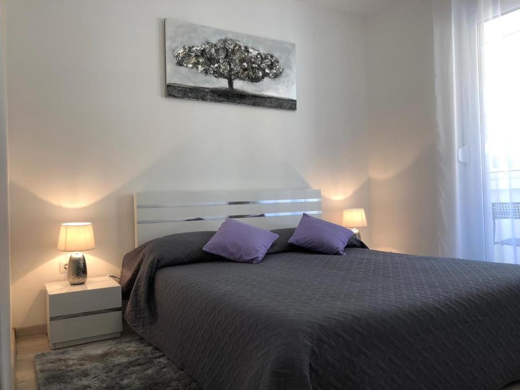 Posteľ alebo postele v izbe v ubytovaní Marea Apartments