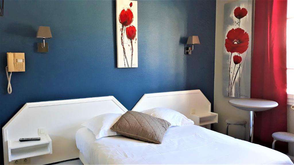 Postel nebo postele na pokoji v ubytování Hotel Le Reynita