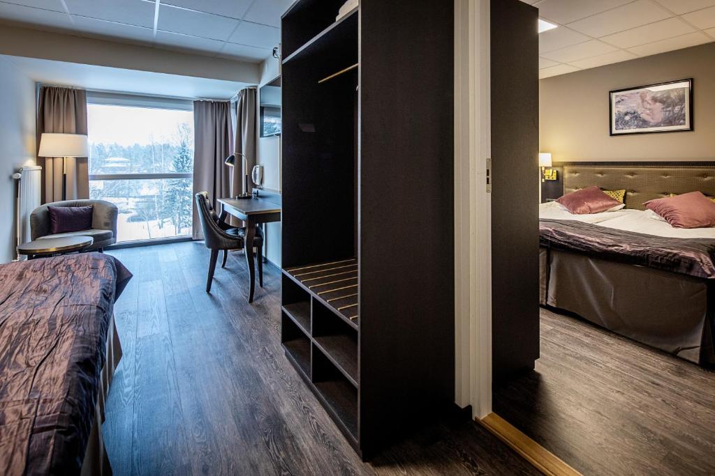 Postel nebo postele na pokoji v ubytování First Hotel Royal