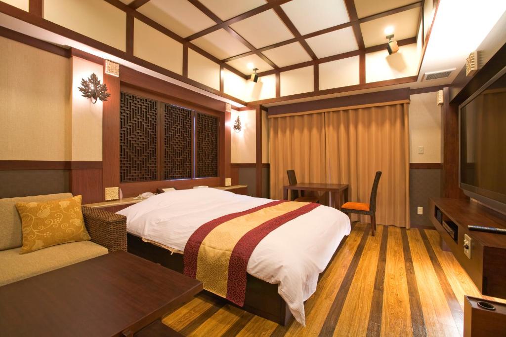 Postel nebo postele na pokoji v ubytování Hotel Bintang Pari Resort (Adult Only)