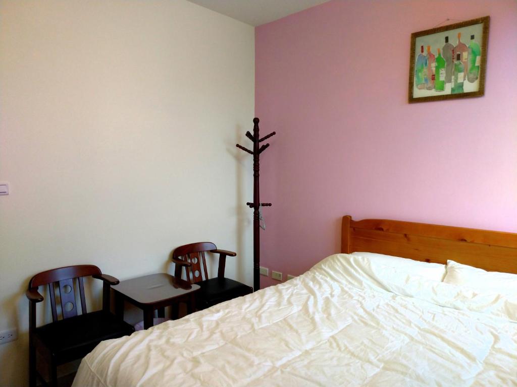 Postel nebo postele na pokoji v ubytování He Tian B&B - Cafe & Bar