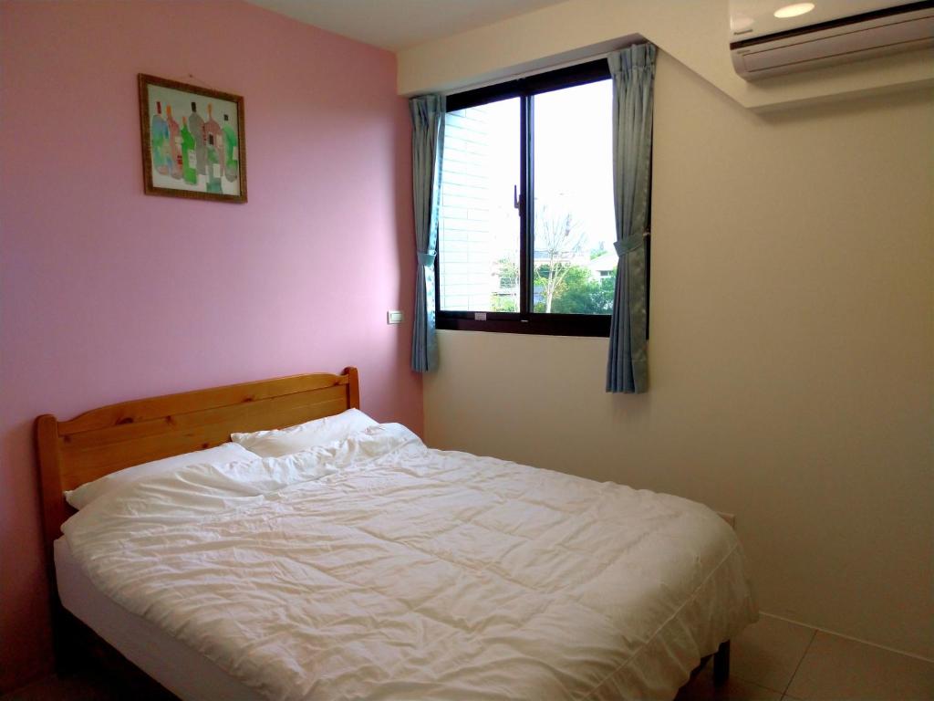 Postel nebo postele na pokoji v ubytování He Tian B&B - Cafe & Bar