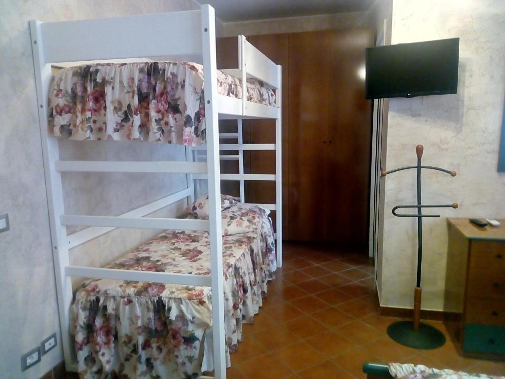 Postel nebo postele na pokoji v ubytování Villa Fabbri