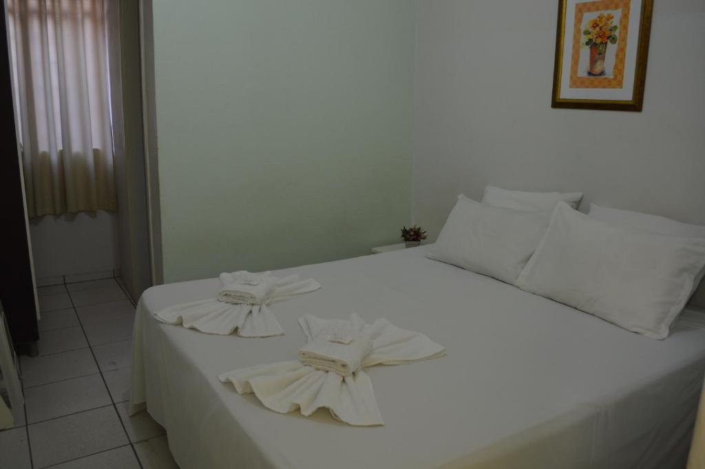 Postel nebo postele na pokoji v ubytování Hotel Confort Maringá