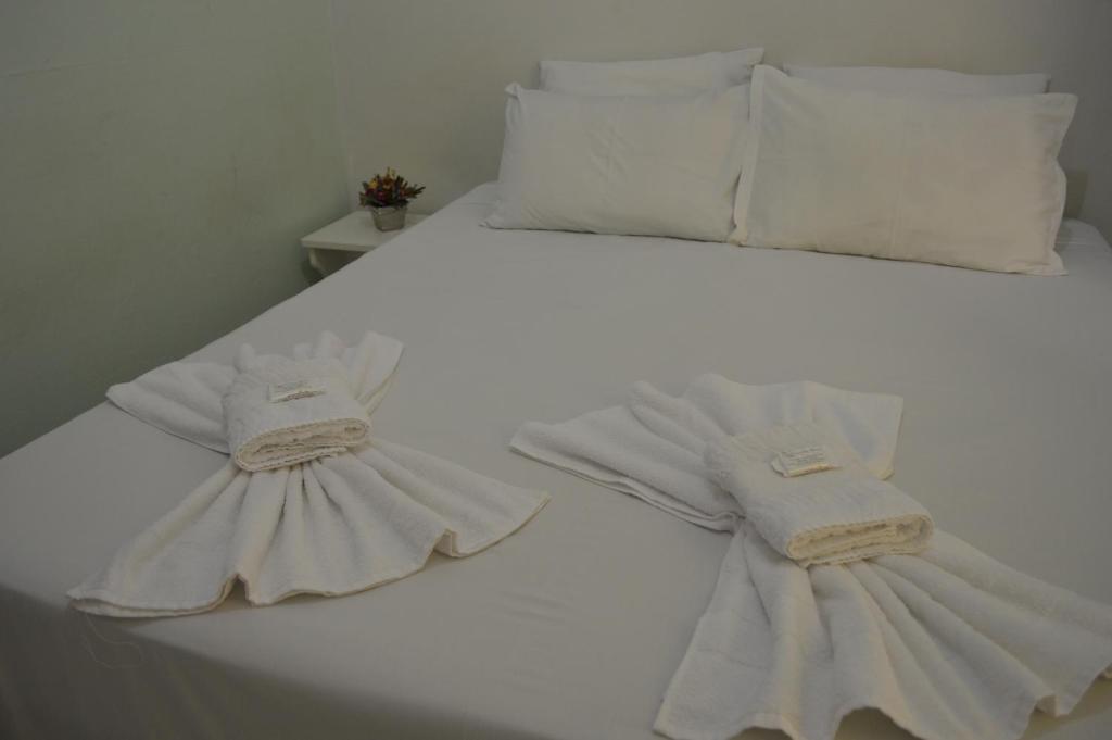Postel nebo postele na pokoji v ubytování Hotel Confort Maringá