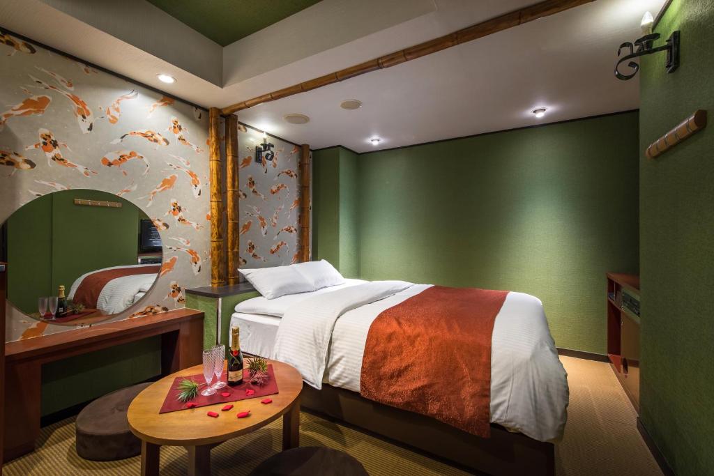 Una cama o camas en una habitación de Hotel Noanoa
