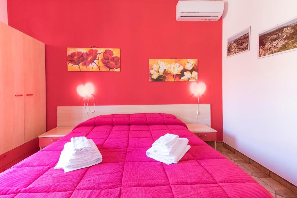 Postel nebo postele na pokoji v ubytování B&B Spiaggia di Ponente