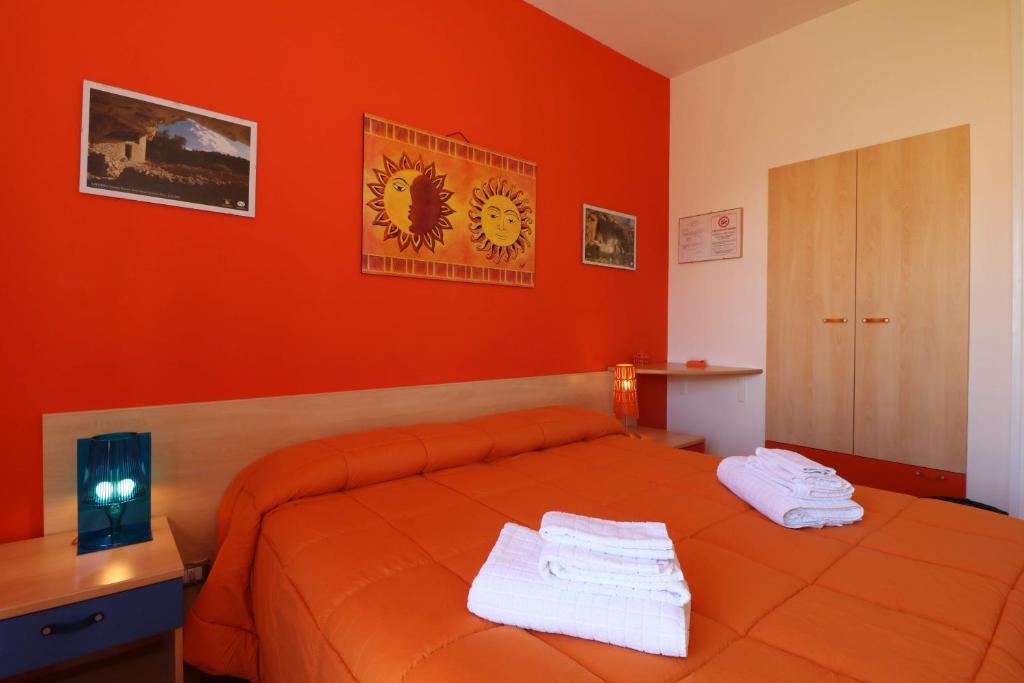 Postel nebo postele na pokoji v ubytování B&B Spiaggia di Ponente