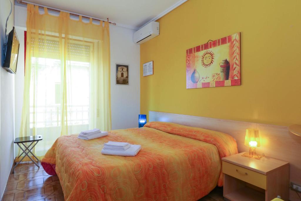 Postel nebo postele na pokoji v ubytování B&B Spiaggia di Ponente