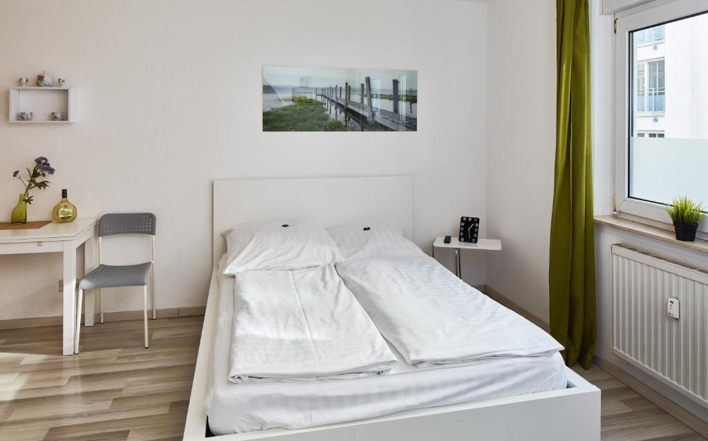 Łóżko lub łóżka w pokoju w obiekcie Apartments 4 YOU - Lange Straße