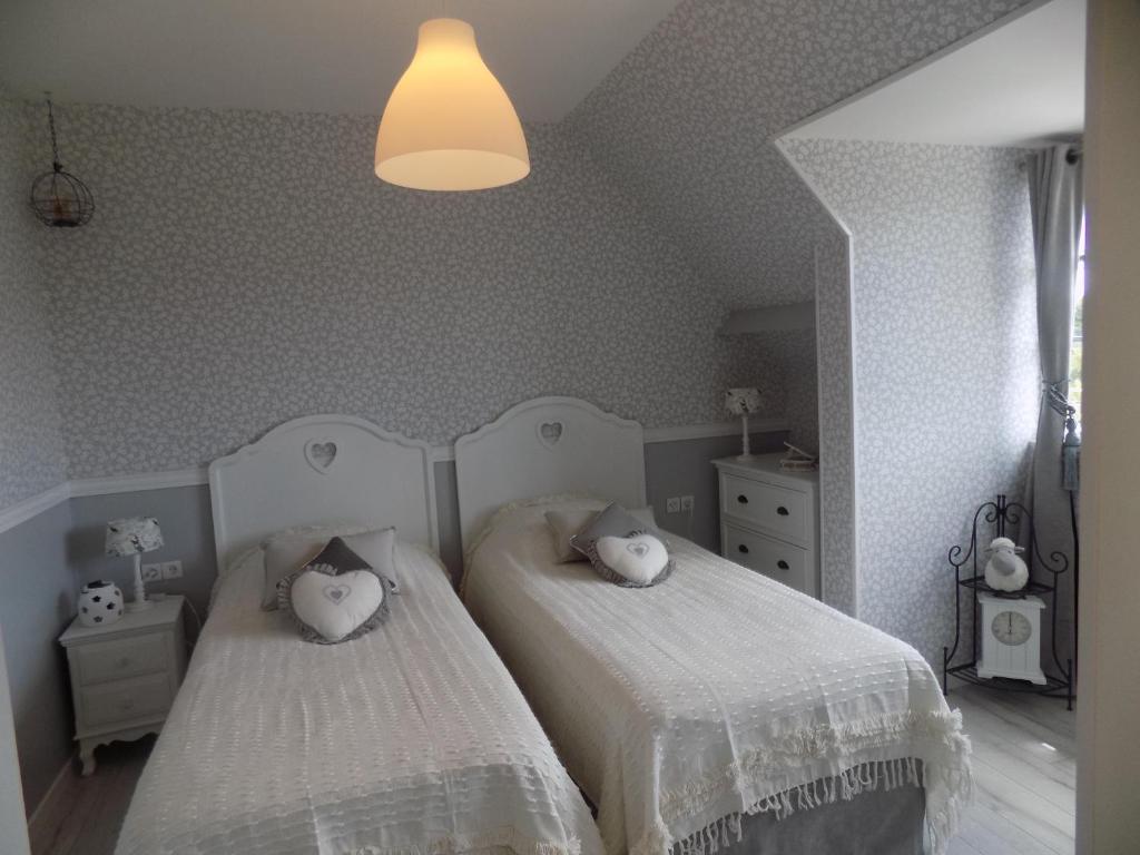 Postel nebo postele na pokoji v ubytování Le Cardinal B&B
