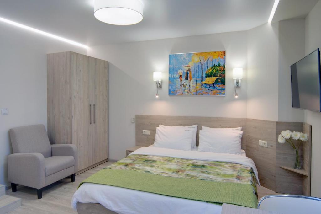 Postel nebo postele na pokoji v ubytování Arena Summit Apart Hotel