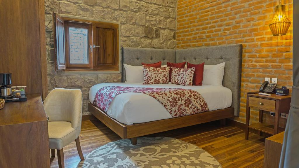 Postel nebo postele na pokoji v ubytování Hotel Otavalo