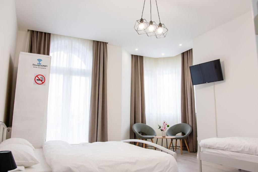 Krevet ili kreveti u jedinici u okviru objekta Grande Plus Apartment Dzungla