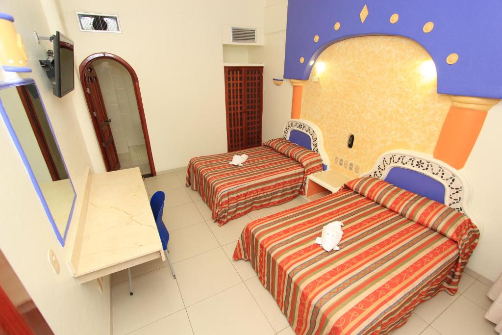 Postel nebo postele na pokoji v ubytování Hotel Xestal