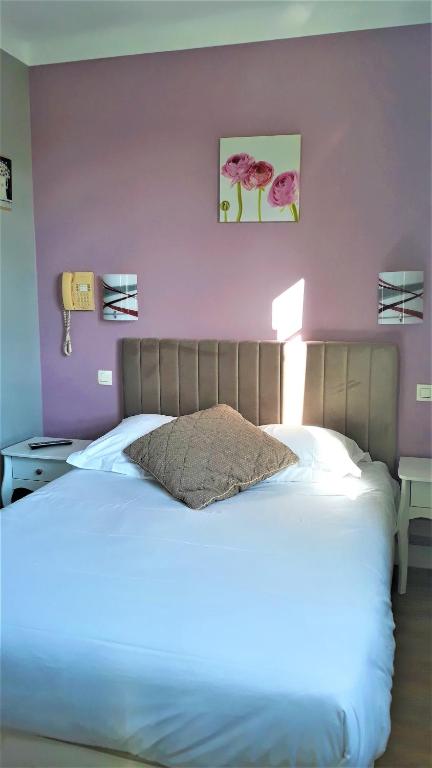 Postel nebo postele na pokoji v ubytování Hotel Le Reynita
