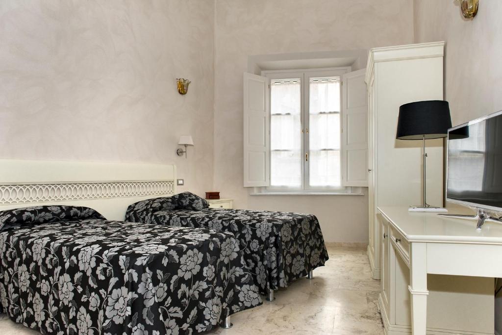 Posteľ alebo postele v izbe v ubytovaní Relais Dei Mercanti B&B And Suites