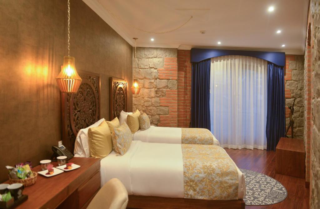 Postel nebo postele na pokoji v ubytování Hotel Otavalo