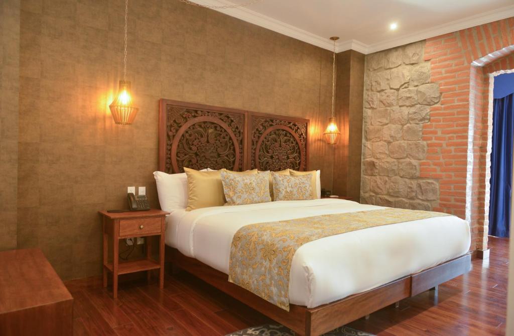 Postel nebo postele na pokoji v ubytování Hotel Otavalo