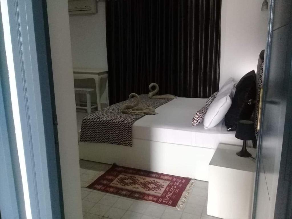 Postel nebo postele na pokoji v ubytování Appartement Touta écologique familial