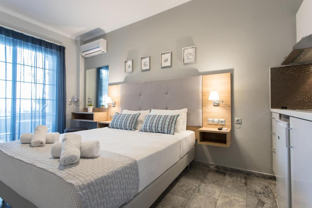 Postel nebo postele na pokoji v ubytování Georgioupolis Beach Hotel