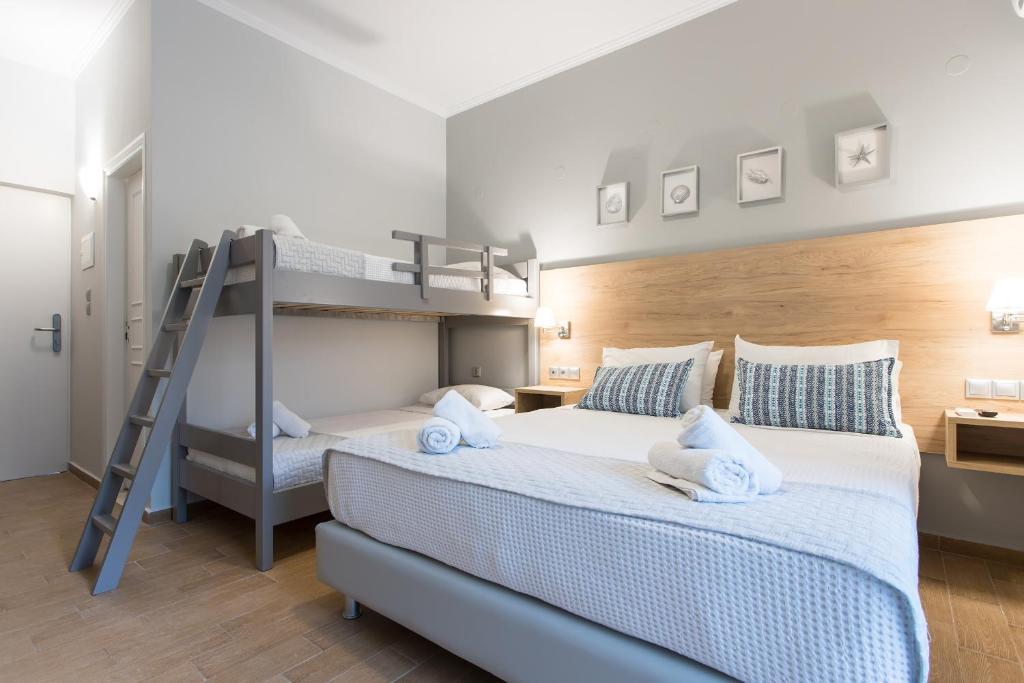 Postel nebo postele na pokoji v ubytování Georgioupolis Beach Hotel