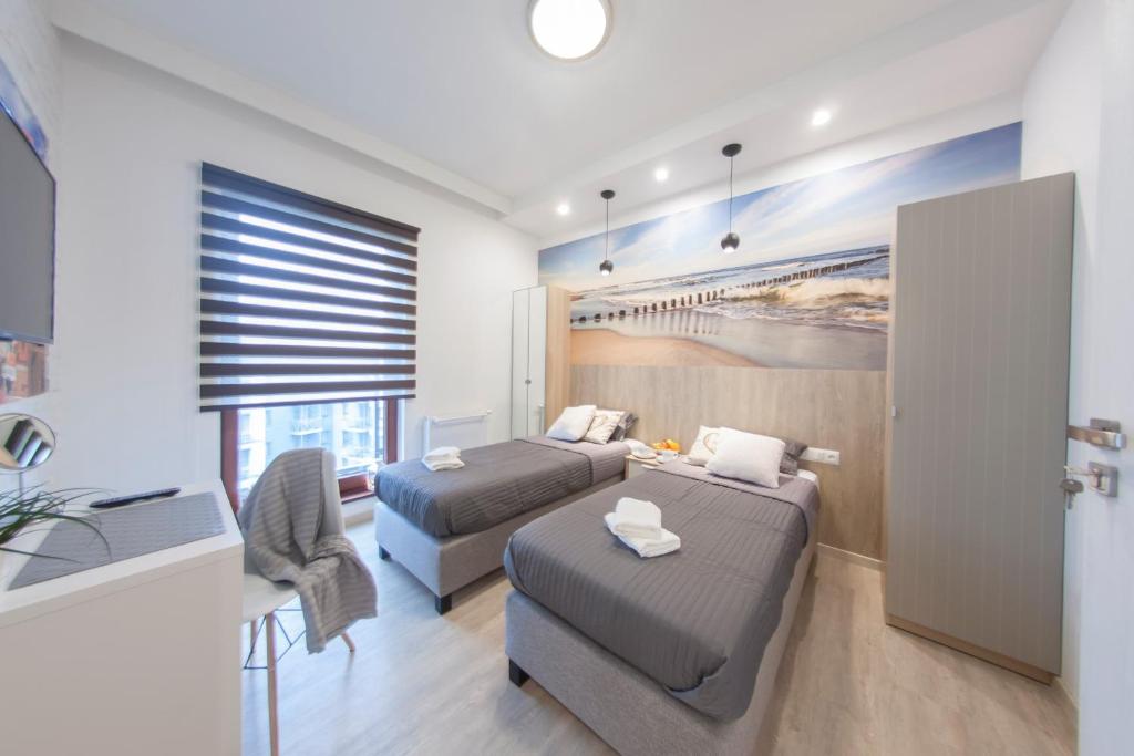 Posteľ alebo postele v izbe v ubytovaní Granary Island Apartment II
