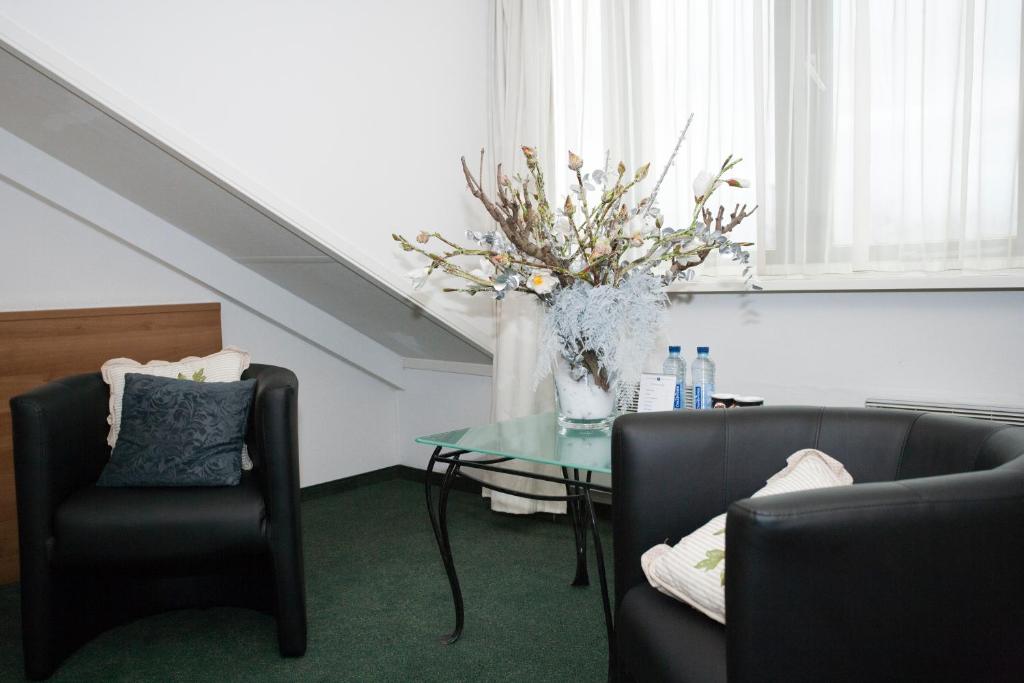 Posezení v ubytování Fletcher Hotel Restaurant Heidehof